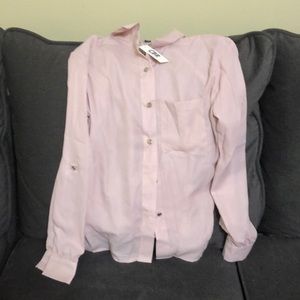 Dress up or dress casual with this light pink top
